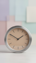 Brushed metal table clock with silent sweep